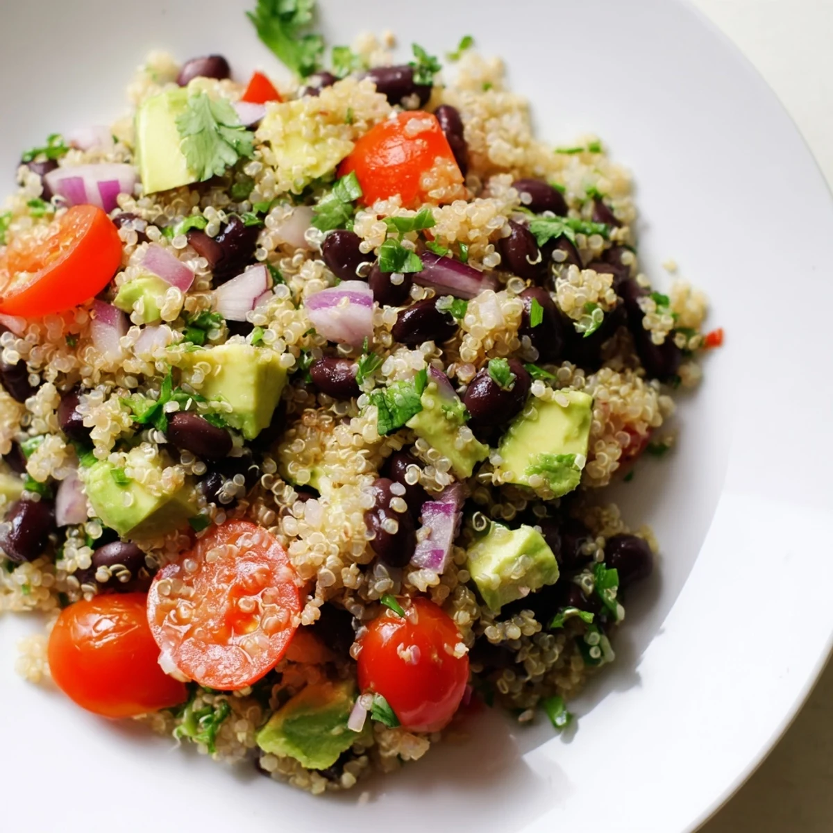 A colorful Quinoa Black Bean Salad bowl, perfect for a fresh, healthy vegetarian lunch.