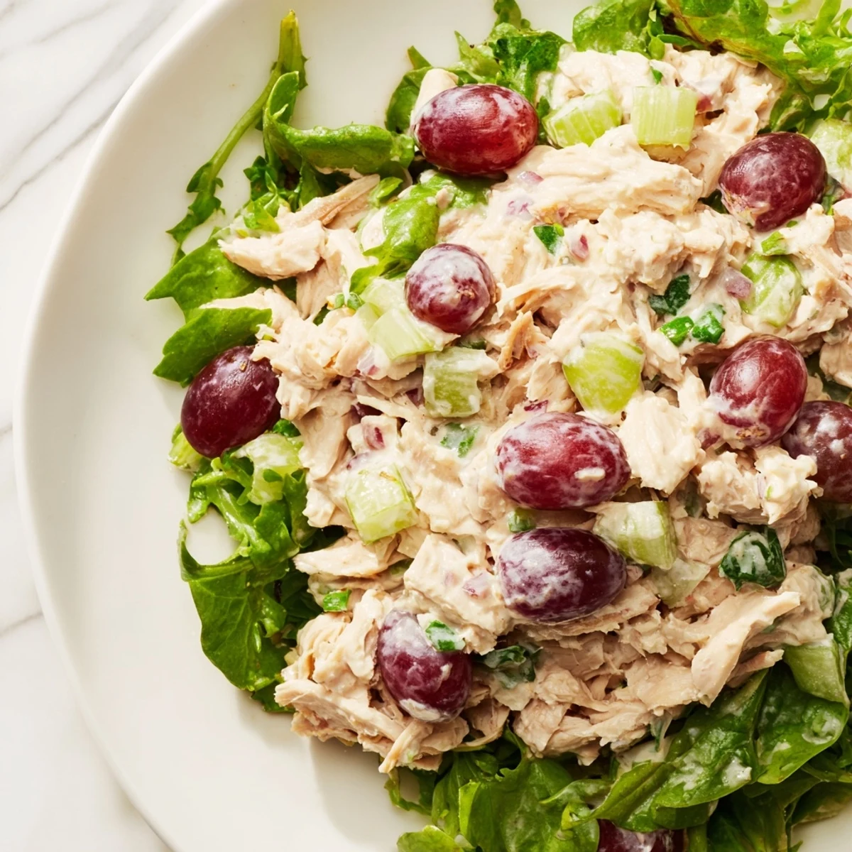 A vibrant and colorful presentation of our Crispy Chicken Salad, generously served on crisp greens.