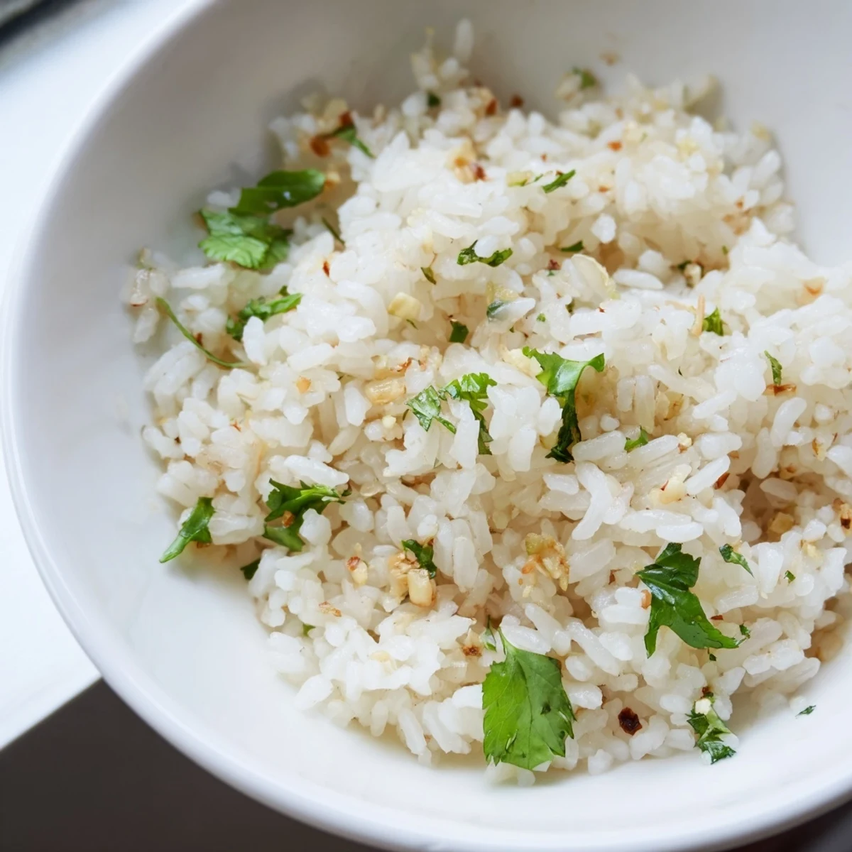 Tender Jasmine Rice Garlic served beside a colorful Asian stir-fry, creating a complete vegan meal.