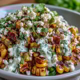 Creamy Mexican Street Corn Salad with charred sweet corn and Cotija cheese.  