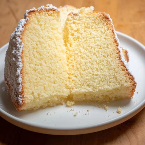 Fluffy Simple 3-Ingredient Vanilla Sponge Cake, golden brown, perfect for serving with fresh berries.