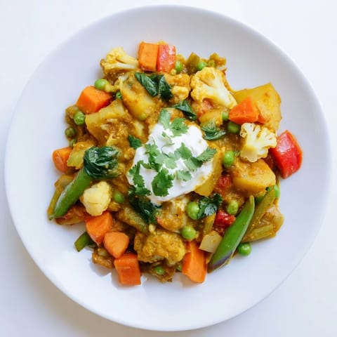 Steaming Waste-Free Vegetarian Curry, a hearty vegetarian dish loaded with fresh, mixed vegetables and spices.