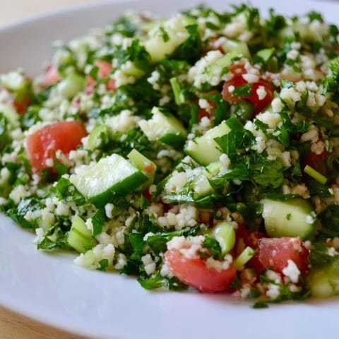 Close-up of a bright, fresh Lebanese Tabbouleh salad, ready to be enjoyed as a side dish.