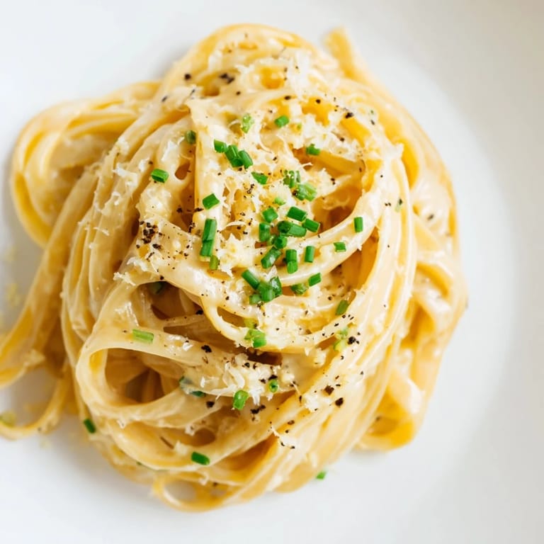 A close-up view of Miso Butter Pasta: perfectly cooked spaghetti glistening with delicious, golden miso butter.