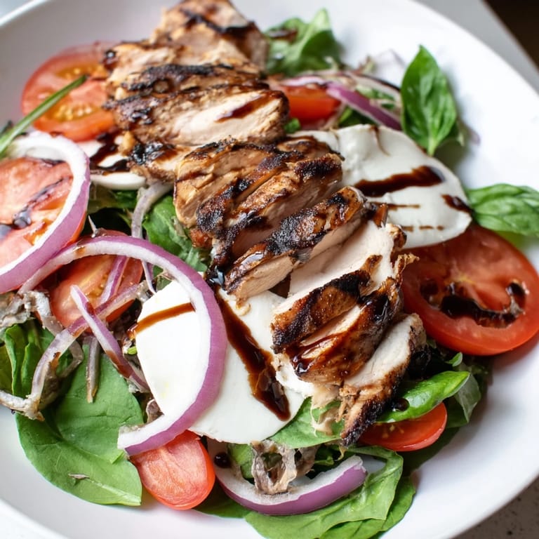 Enjoy fresh basil and creamy mozzarella in this flavorful Caprese Chicken Salad, ready in minutes.