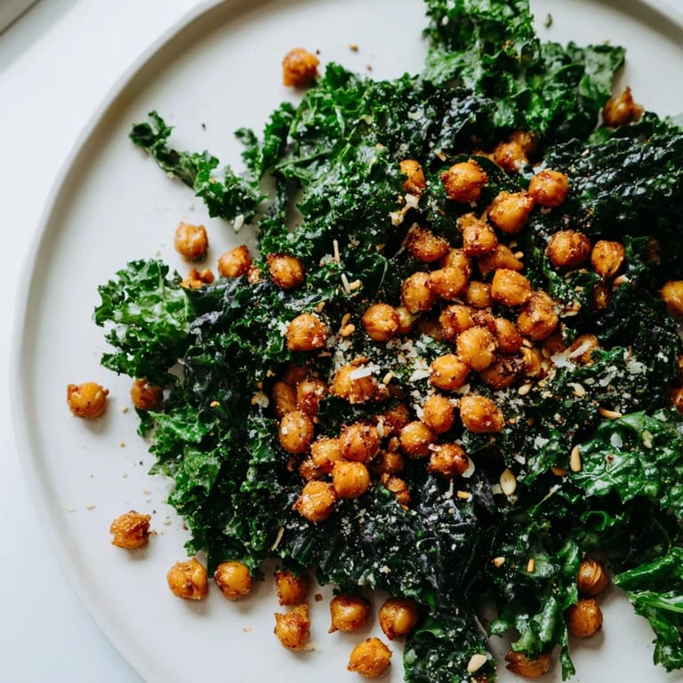 A bowl of warm Kale Salad with Crispy Chickpeas, featuring golden-brown, perfectly roasted chickpeas.